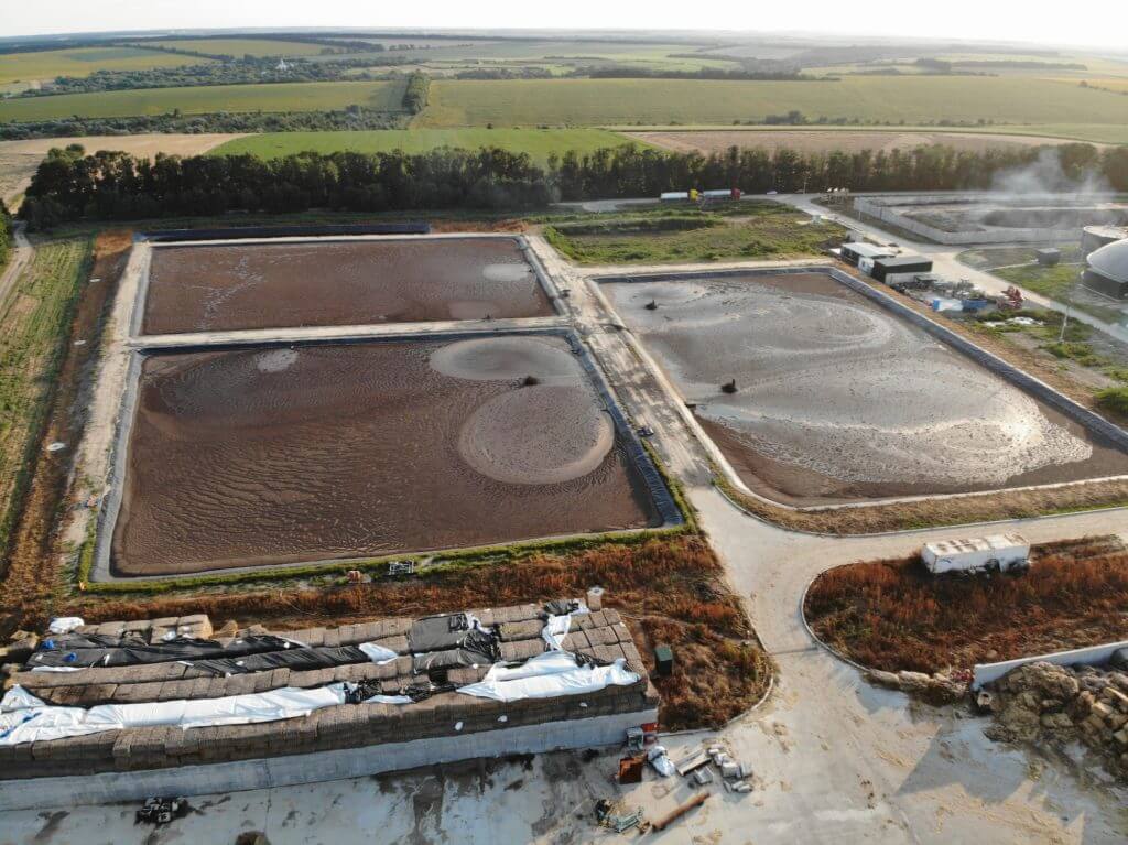 Aerial view of wastewater treatment plant at sunset, filtration of dirty or sewage water.